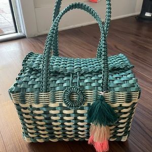 Teal/ cream colored bag. Made in Mexico.